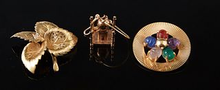 Three Pieces of 14K Yellow Gold Jewelry, consisting of a leaf brooch, a circular brooch with with five cabochon pear shaped semi-precious stones, and 