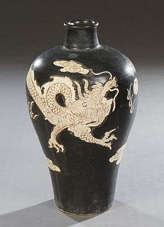 Oriental Black Porcelain Baluster Vase, 20th c., with dragon and cloud decoration, H.- 13 in., Dia.- 7 1/4 in.