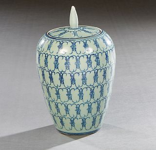 Chinese Pale Blue Baluster Covered Jar, with dark blue geometric decoration, the underside with a blue pictorial mark, within concentric blue circles,