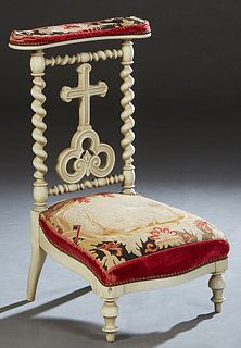 French Polychromed Oak Prie Dieu, 19th c., the curved upholstered armrest over a cruciform back splat, flanked by rope twist supports, to a bowed upho