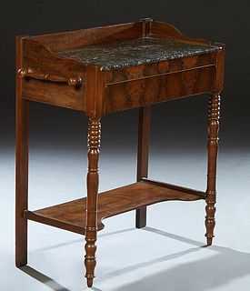 Diminutive French Carved Walnut Louis Philippe Carved Walnut Marble Top Washstand, the 3/4 wood splash over a highly figured gray marble, above a frie