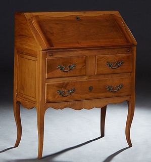 French Louis XV Style Carved Walnut Slant Front Desk, 20th c., the rectangular top over a serpentine slant lid with an inset gilt tooled leather writi