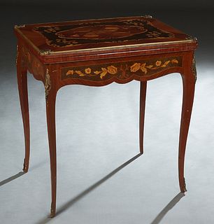 Louis XV Bronze Mounted Marquetry Inlaid Mahogany Games Table, 20th c., the floral inlaid top swiveling to a baize lined playing surface, over a serpe