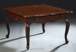 Louis XV Style Carved Mahogany Coffee Table, 20th c., the shaped stepped cookie corner top over a wide scalloped skirt with one long drawer, on cabrio