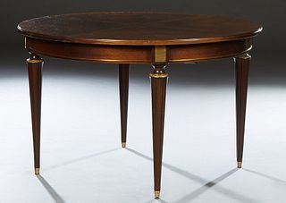 French Louis XVI Style Ormolu Mounted Walnut Dining Table, the circular top over a wide skirt, on four turned tapered reeded legs, with two leaves, H.