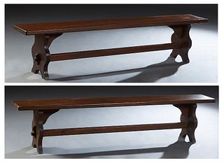 Pair of French Provincial Carved Oak Benches, early 20th c., the thick rectangular top on shaped trestle bases, joined by a rectangular stretcher, H.-