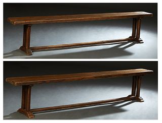 Two French Provincial Carved Oak Benches, 20th c., the rectangular plank top on square trestle bases joined by a rectangular stretcher, H.- 18 1/4 in.