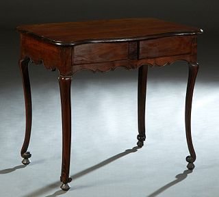 French Louis XV Style Cherry Writing Table, 19th c., the stepped serpentine top over two setback frieze drawers, on cabriole legs with toupie feet, H.