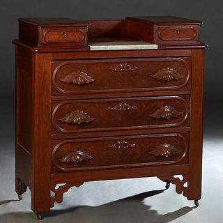 American Carved Walnut Marble Top Dresser Base, c. 1880, the two glove drawers on top flanking an inset white center marble, over three drawers with l