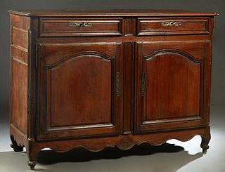 French Provincial Louis XV Style Carved Walnut Sideboard, 19th c., the stepped rounded corner three board top over two frieze drawers and double field