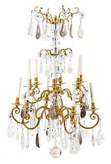 A Continental Gilt Bronze and Rock Crystal Twelve-Light Chandelier Height 45 x diameter 28 inches.