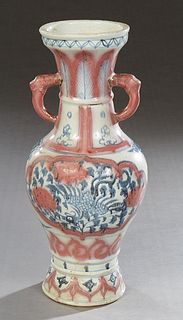 Chinese Blue and Red Porcelain Baluster Vase, 20th c., the everted rim over a neck with elephant head ring handles, above sides with floral and bird d