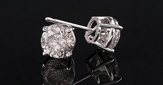 Pair of 14K White Gold Round Diamond Stud Earrings, one 1 ct., one .96 cts, total diamond wt.- 1.96 cts.