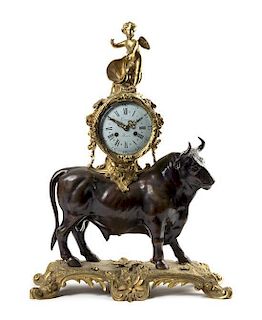 A French Gilt and Patinated Bronze Figural Mantel Clock Height 24 1/8 inches.
