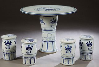 Chinese Five Piece Porcelain Patio Set, 20th c., consisting of a circular table with bird and bamboo decoration and four cylindrical stools, H.- 28 3/