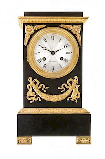 * An Empire Gilt Metal Mounted Steel Mantle Clock Height 12 1/4 inches.