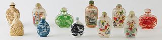 Group of Eleven Chinese Snuff Bottles, 20th c., consisting of two porcelain examples; two Peking glass examples; five interior painted examples; an iv