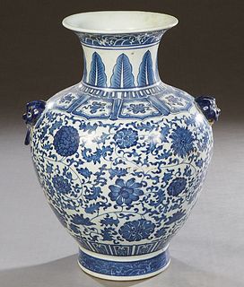 Large Chinese Blue and White Porcelain Baluster Vase, 20th c., with applied Foo dog and ring handles, over leaf and floral decorated sides, the unders