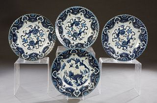 Set of Four Oriental Blue and White Bowls, 20th c., with lion and cloud decoration, H.- 2 1/4 in., Dia.- 11 3/4 in.