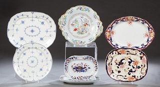 Group of Eight English Ironstone Pieces, 19th c., consisting of two circular platters; a floral and gilt decorated serving platter; three graduated oc