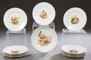 French Thirteen Piece Limoges Porcelain Game Set, 20th c., consisting of 12 circular plates and a circular serving bowl, each with transfer decoration