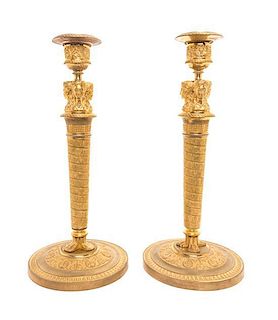 A Pair of Empire Gilt Bronze Candlesticks Height 11 1/4 inches.