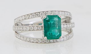 Lady's Platinum Dinner Ring, with a 1.65 carat emerald atop three pierced bands mounted with small round diamonds, total diamond wt.- .6 cts., Size 6 