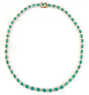 14K Yellow Gold Link Necklace, each of the 50 oval links with a graduated oval emerald atop a border of tiny round diamonds, total emerald wt.- 20.75 