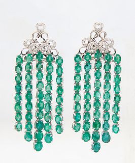 Pair of 14K White Gold Tasseled Earrings, the pierced diamond mounted stud suspending six oval emerald mounted chains, total diamond wt.- .54 cts., to