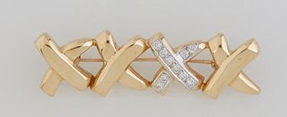 18K Yellow Gold "X"Bar Pin, composed of four joined Letter X's, one mounted with ten round 10 point diamonds, Total Diamond Wt.- 1 ct., H.- 5/8 in., W