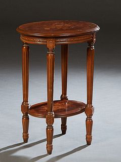 French Louis XVI Style Marquetry Inlaid Carved Cherry Lamp Table, 20th c., the oval stepped floral inlaid top over a carved skirt, on turned tapered r