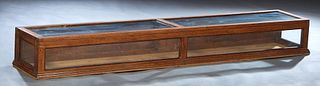 American Carved Oak Counter Top Display Case, c. 1900, with a glass top, front and sides, the rear with two hinged drop doors, H.- 9 in., W- 14 in.
