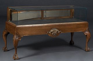 Chippendale Style Carved Oak Sit Down Store Showcase, with glass top, front and sides, with sliding doors behind, on ball-and-claw feet, H.- 32 3/4 in