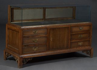 Chippendale Style Carved Oak Sit Down Store Showcase, with glass top, front and sides, with sliding doors behind, on ball-and-claw feet, H.- 32 3/4 in