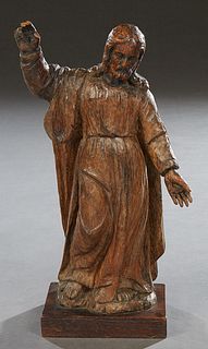 Flemish Carved Wooden Statue of Jesus, 19th c., with one hand raised, on an integral rectangular plinth, H.- 10 1/2 in., W.- 5 1/2 in., D.- 3 in.