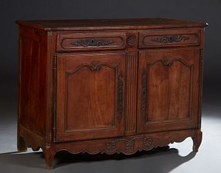 French Provincial Louis XV Style Carved Cherry Sideboard, 19th c., the stepped canted corner rectangular top over two frieze drawers above double cupb