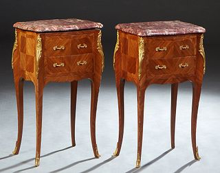 Pair of French Louis XV Style Carved Cherry Bowfront Marble Top Nightstands, 20th c., the stepped canted corner highly figured violette marble over a 