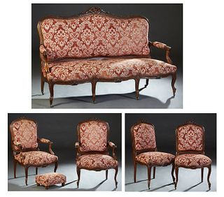 French Six Piece Louis XV Style Carved Walnut Parlor Suite, early 20th c., consisting of a settee with an arched crest rail with scroll, floral and le