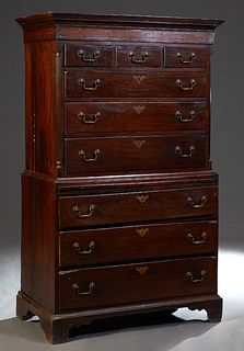English Carved Oak Chest-on-Chest, 19th c., the stepped crown over three drawers above three graduated drawers, flanked by rounded edge pilasters, on 