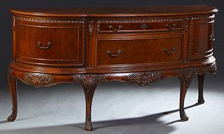 Chippendale Style Carved Mahogany Bowfront Sideboard, 20th c., the stepped serpentine top over a bank of two convex drawers, flanked by fielded panel 