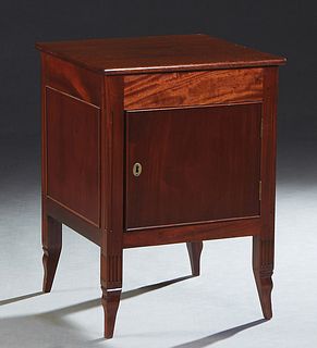 French Louis XV Style Carved Mahogany Nightstand, late 19th c., the square top over a frieze drawer and a large cupboard door, on reeded tapered squar