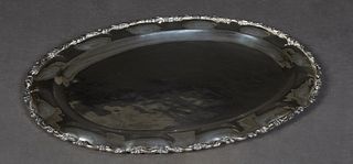 Mexican Sterling Oval Repousse Tray, stamped "Eddie's", with a relief scrolled edge around a border of repousse ovals, H.- 3/4 in., W.- 19 1/4 in., D.