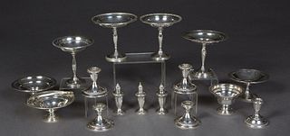 Group of Sixteen Pieces of Weighted Sterling, consisting of three salt and pepper shakers, five low candlesticks, seven footed compotes, and a handled