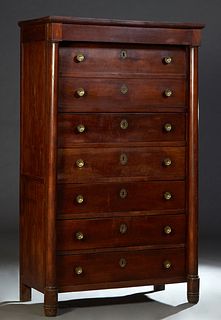 Unusual Large French Empire Style Carved Walnut Semainier, 19th c., the stepped crown over a "secret" top drawer above seven setback deep drawers, fla