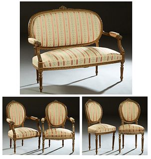French Louis XVI Style Five Piece Carved Beech Parlor Suite, c. 1900, consisting of a settee, two fauteuils, and two side chairs, each with garland an