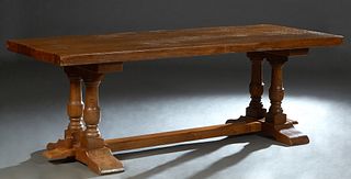 French Carved Oak Monastery Table, early 20th c., the 2 3/4 in. thick top on double urn form trestle supports joined by a rectangular stretcher, H.- 3