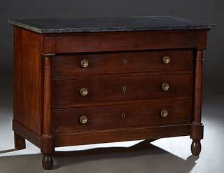 French Empire Style Carved Walnut Marble Top Commode, 19th c., the figured black marble over a frieze drawer above three setback deep drawers, flanked