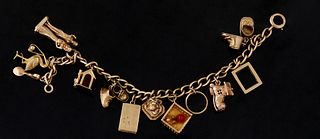 Tiffany 18K Yellow Gold Charm Bracelet, with 12- 10K and 14K Charms, L.- 7 1/2 in., Total Wt.- 1.45 Troy Oz.