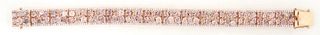 Lady's 18K Rose Gold Link Bracelet, each of the 15 rectangular links mounted with six multi-toned pink diamonds, of oval, pear, and radiant shapes, wi