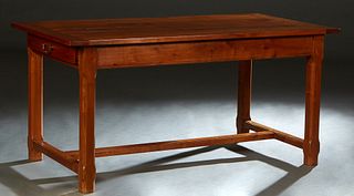 French Provincial Carved Cherry Farmhouse Table, early 20th c., the rectangular top over a skirt with two end drawers, on chamfered legs joined by a r